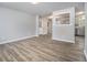 Spacious open-concept living area featuring wood floors and a seamless transition to the kitchen at 898 Doeskin Nw Dr, Conyers, GA 30012