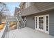 Back of home featuring a gray deck with steps and white French doors at 101 Saddlehorn Ct, Woodstock, GA 30188