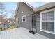 Back deck of a home featuring gray siding, steps to the yard and a screen door at 101 Saddlehorn Ct, Woodstock, GA 30188
