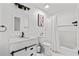 Bathroom with modern vanity, stylish black accents, and combined tub/shower at 101 Saddlehorn Ct, Woodstock, GA 30188
