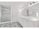 Bathroom featuring double sink vanity, decorative tile floor, and glass shower at 101 Saddlehorn Ct, Woodstock, GA 30188