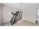 Cozy carpeted bedroom with an upright mirror, neutral walls and modern lighting at 101 Saddlehorn Ct, Woodstock, GA 30188