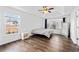 Bedroom with wood floors, large windows, and a trey ceiling at 101 Saddlehorn Ct, Woodstock, GA 30188