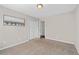 Bedroom featuring neutral walls, carpet, and a closet at 101 Saddlehorn Ct, Woodstock, GA 30188