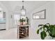 Dining area featuring pendant lighting, wine storage, and views from the window at 101 Saddlehorn Ct, Woodstock, GA 30188