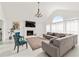 Elegant living room features a fireplace, vaulted ceilings, and ample natural light, ideal for relaxation at 101 Saddlehorn Ct, Woodstock, GA 30188