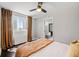 Bright bedroom featuring dark hardwood floors, a city view, and comfortable bedding at 215 Piedmont Ne Ave # 1509, Atlanta, GA 30308
