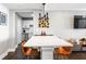 Dining room area features hardwood floors, an art deco light fixture, and art on the walls at 215 Piedmont Ne Ave # 1509, Atlanta, GA 30308