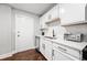 This kitchen features stainless steel appliances, white cabinets, and a white backsplash at 215 Piedmont Ne Ave # 1509, Atlanta, GA 30308