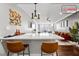 Stylish living room features a breakfast bar, hardwood floors, and an orange velvet sofa at 215 Piedmont Ne Ave # 1509, Atlanta, GA 30308