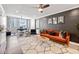Spacious living room with floor to ceiling windows, modern furnishings, and a ceiling fan at 215 Piedmont Ne Ave # 1509, Atlanta, GA 30308