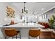 Stylish living room features a breakfast bar, hardwood floors, and an orange velvet sofa at 215 Piedmont Ne Ave # 1509, Atlanta, GA 30308