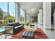 Elegant lobby area with large windows, stylish seating, and views of the outdoors at 215 Piedmont Ne Ave # 1509, Atlanta, GA 30308