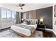Spacious main bedroom with city view, modern furnishings, and comfortable bedding at 215 Piedmont Ne Ave # 1509, Atlanta, GA 30308