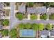 Aerial view of home with nearby tennis courts and landscaped surroundings at 2810 Olde Town Park Dr, Norcross, GA 30071