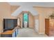 Bedroom with sloped ceilings, window, and built-in dresser at 2810 Olde Town Park Dr, Norcross, GA 30071