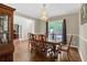 Elegant dining room featuring hardwood floors, a chandelier, and classic wood furniture at 2810 Olde Town Park Dr, Norcross, GA 30071