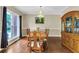 Traditional dining room with hardwood floors, chandelier, and elegant wood furniture at 2810 Olde Town Park Dr, Norcross, GA 30071