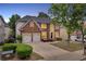 Beautiful two-story brick home with a well-manicured lawn and a two-car garage and long driveway at 2810 Olde Town Park Dr, Norcross, GA 30071