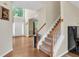 Bright foyer with hardwood floors, staircase, and tall ceilings flooded with natural light at 2810 Olde Town Park Dr, Norcross, GA 30071