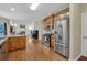 Open kitchen features stainless steel appliances and hardwood flooring at 2810 Olde Town Park Dr, Norcross, GA 30071