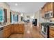 Open kitchen has granite countertops and stainless appliances; opens to Gathering room at 2810 Olde Town Park Dr, Norcross, GA 30071