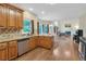 Kitchen with natural light and granite countertops opens to Gathering room at 2810 Olde Town Park Dr, Norcross, GA 30071