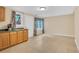 Features a kitchenette with oak cabinets, tile floors, a door to the backyard, and a stainless steel sink at 2810 Olde Town Park Dr, Norcross, GA 30071