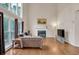 Bright living room boasts large windows, a fireplace, and hardwood floors at 2810 Olde Town Park Dr, Norcross, GA 30071