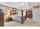 Spacious main bedroom has tray ceiling, ceiling fan, and carpet at 2810 Olde Town Park Dr, Norcross, GA 30071
