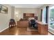 Bright home office space with hardwood floors, built-in desk, and ample natural light at 2810 Olde Town Park Dr, Norcross, GA 30071