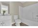 This bathroom features a single sink vanity, toilet, and a tub-shower combo at 3425 Sweet Basil Ln, Loganville, GA 30052