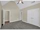 Bright bedroom featuring vaulted ceilings, access to the bath, and a double door closet at 3425 Sweet Basil Ln, Loganville, GA 30052