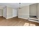 The dining room showcases hardwood floors, neutral paint, white doors, and access to stairs at 3425 Sweet Basil Ln, Loganville, GA 30052