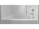 A close up on a white tub-shower combo featuring a soap dish and metal fixtures at 3425 Sweet Basil Ln, Loganville, GA 30052