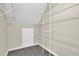 Walk-in closet with wire shelves and carpeting at 3425 Sweet Basil Ln, Loganville, GA 30052