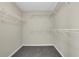 Walk-in closet with wire shelving and gray carpeting at 3425 Sweet Basil Ln, Loganville, GA 30052