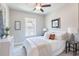 Cozy bedroom with a neutral color scheme, white bedding, and stylish accents at 3808 Jack Vernon Cir, Powder Springs, GA 30127
