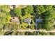 Overhead aerial shot of a single Gathering home surrounded by mature trees and lush landscaping at 3951 Lindley Dr, Powder Springs, GA 30127