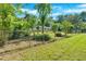 View of the fenced in backyard and a glimpse of the house from behind the fence at 3951 Lindley Dr, Powder Springs, GA 30127