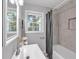 Well-lit bathroom offers a bathtub with shower, large mirror and vanity for added convenience at 3951 Lindley Dr, Powder Springs, GA 30127