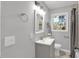 Modern bathroom features a vanity, toilet, and a shower with new fixtures and neutral tones at 3951 Lindley Dr, Powder Springs, GA 30127