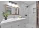 Well lit bath with new vanity, decorative fixtures, and shower featuring marble tile, great style! at 3951 Lindley Dr, Powder Springs, GA 30127