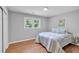 Bright bedroom features hardwood floors, closet, and a window providing natural light at 3951 Lindley Dr, Powder Springs, GA 30127