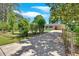 Exterior shot of a home with a long driveway leading up to the carport at 3951 Lindley Dr, Powder Springs, GA 30127