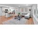 Inviting living room featuring hardwood floors, a comfortable gray sofa, and natural light at 3951 Lindley Dr, Powder Springs, GA 30127