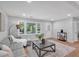 Bright living room with modern decor, a stylish rug, and an inviting gray sofa at 3951 Lindley Dr, Powder Springs, GA 30127