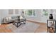 Cozy living room with a comfortable gray sofa and a stylish decorative rug at 3951 Lindley Dr, Powder Springs, GA 30127