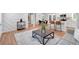 Open-concept living space featuring seamless transitions to dining and kitchen areas, perfect for modern living at 3951 Lindley Dr, Powder Springs, GA 30127