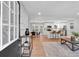 Bright, open-concept living space with modern decor, flowing into the dining area and kitchen at 3951 Lindley Dr, Powder Springs, GA 30127